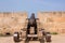 Old antique iron cannon on the old defence tower of Punta de N`Amer