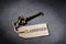 Old antique key and a label with the word classified and copy space for your text rest on a slate background