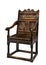 Old antique oak wainscot chair with carving isolated on white