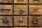 Old antique wooden drawers, rows of little drawers in an old furniture module, Storage archive wooden background texture vintage