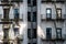 Old Apartment Building with Brick Facade Painted in White in New York City