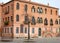 Old apartment building, red, in Murano in the town of Venice Veneto (Italy)