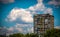 Old apartment building under blue sky with clouds in east Europe