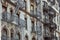 Old apartment facades, with fire stairs. Soho, Manhattan. NYC