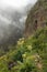 An old aqueduct now used as an adventure hiking trail Guimar valley. Trail in the fog through the mysterious mountains and caves.