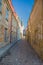 Old archaic narrow street in medieval downtown