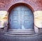 Old arched door and steps