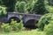 Old arched span bridge countryside river