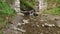 Old arched stone abandoned half-destroyed railroad bridge in Carpathians