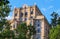 Old architecture in sunny Moscow framed with green tree branches