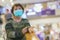 Old asian woman in a mask for COVID-19, for protection against the crown virus. Asian senior woman with protective mask because di