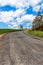 Old asphalt road in the countryside in the Czech Republic. Country road. Spring day on the road