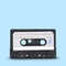 Old audio tape cassette on blue background