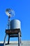 An old Australian windmill pump and water tank