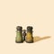 An old authentique antique metal binoculars on beige background with sunny shadow