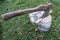 Old ax next to a bunch of birch firewood