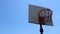Old backboard with basketball hoop high in the sky