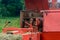 Old bale press, hay harvesting in the village for cattle, press work close up