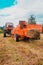 Old bale press, hay harvesting in the village for cattle, press work close up