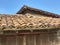 Old Balkan house roofs. Vintage village clay tiles roof