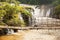 Old bamboo footbridge over Tad Pha Suam waterfall