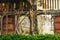 Old banyan tree`s roots grow over old brick wall.