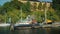 An old barge moored off the coast, in the background of Stockholm apartment buildings