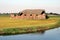 Old barn on a field.