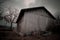 Old barn in front of a dramatic sky
