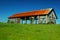 Old Barn In Grass Field