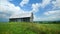 Old barn in middle of field