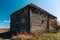 Old barn near pond. Country landscape