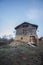 Old barn near a rural road in a mountain village.