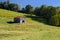 An old barn stands in the middle of a farm