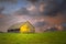 Old barn under dark skies with soft focus