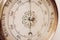 Old barometer dial close up with added grain