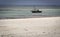 Old barque moored at an African beach