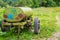 Old barrel for drinking water on wheels. Water tank trailer