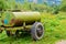 Old barrel for drinking water on wheels. Water tank trailer