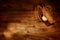 Old Baseball Glove and Ball on Wood Background