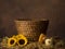 Old basket beehive and sunflowers