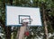 Old basketball hoop on the concrete pole.