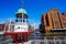 Old beacon or small lighthouse near river channel in Hamburg Hafencity