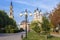 An old beautiful church behind autumn tree. Religious architecture of Russia.