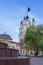 An old beautiful church behind autumn tree. Religious architecture of Russia.