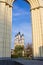 An old beautiful church behind monument to World War Two on background of blue sky. Religious architecture of Russia.