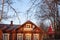 Old beautiful manor house in the forest at dawn