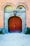 Old beautiful street gate on brick wall background. Architecture. Details.