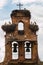 Old bell gable invaded by stork nestes in a village of Spain