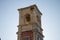 Old bell tower with some plants growing on it